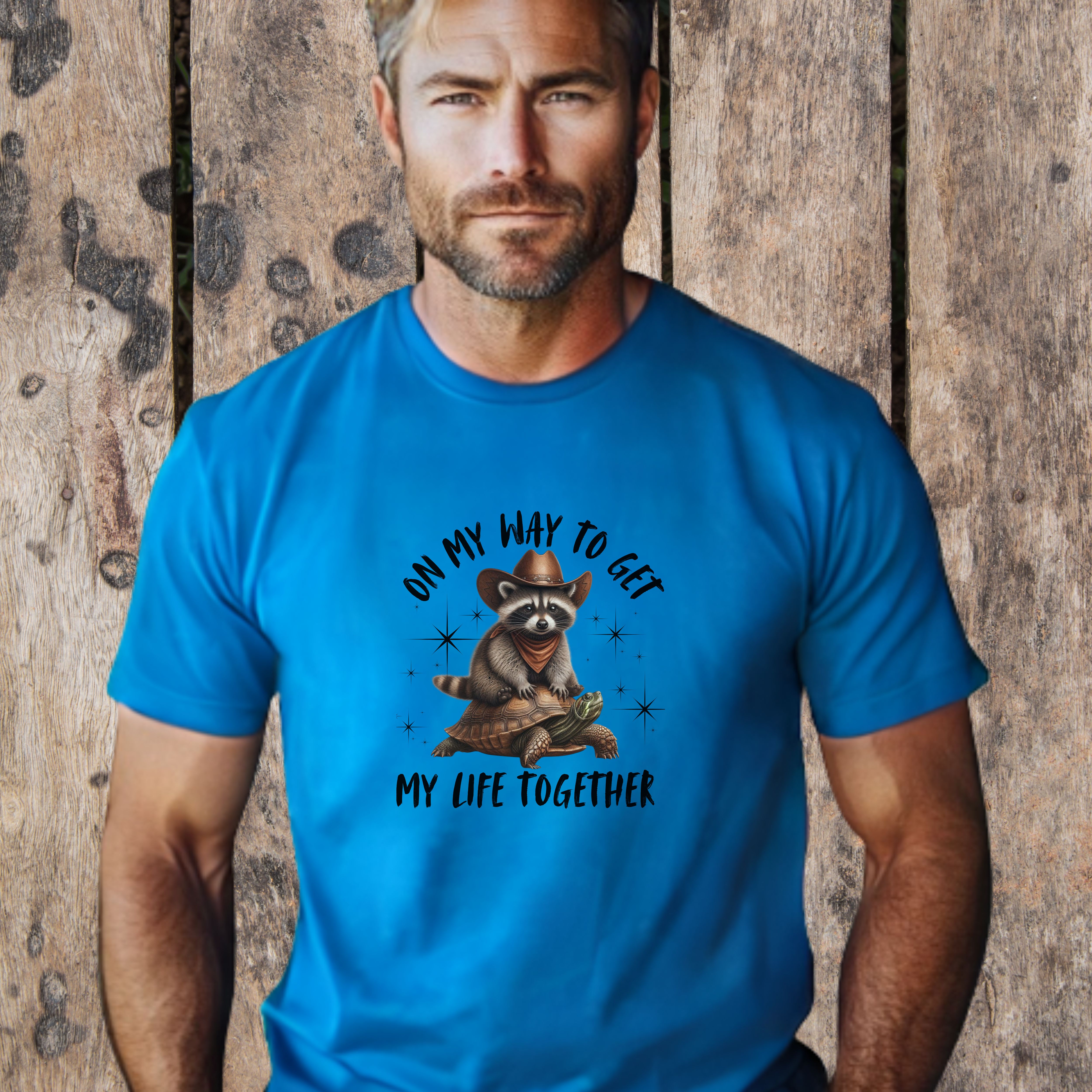Racoon Riding A Turtle Unisex Heavy Cotton Tee product thumbnail image Racoon Riding A Turtle Unisex Heavy Cotton Tee product thumbnail image