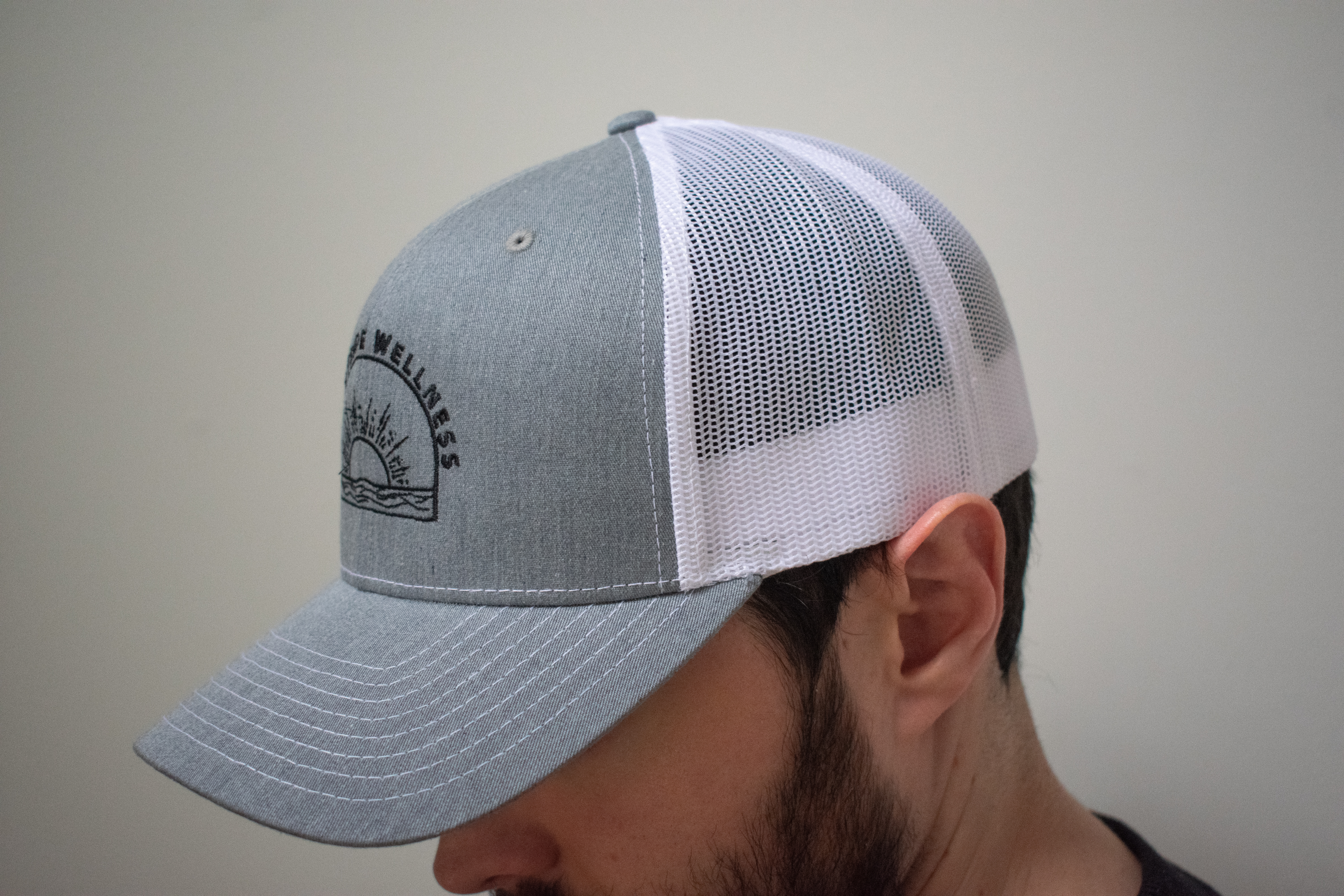 Sunnyside Wellness: Embroidered Trucker Hat product thumbnail image Sunnyside Wellness: Embroidered Trucker Hat product thumbnail image