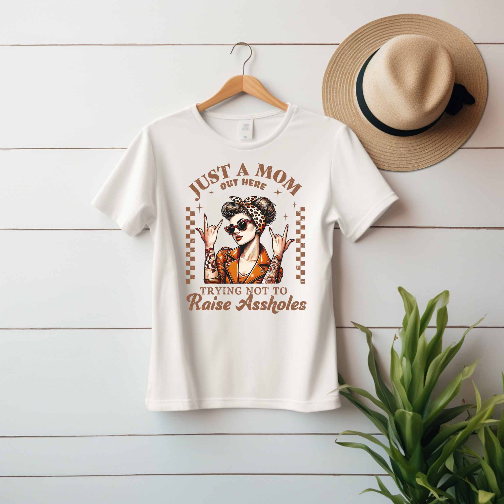 “Just a Mom Out Here Trying Not to Raise Assholes” Unisex Jersey Tee