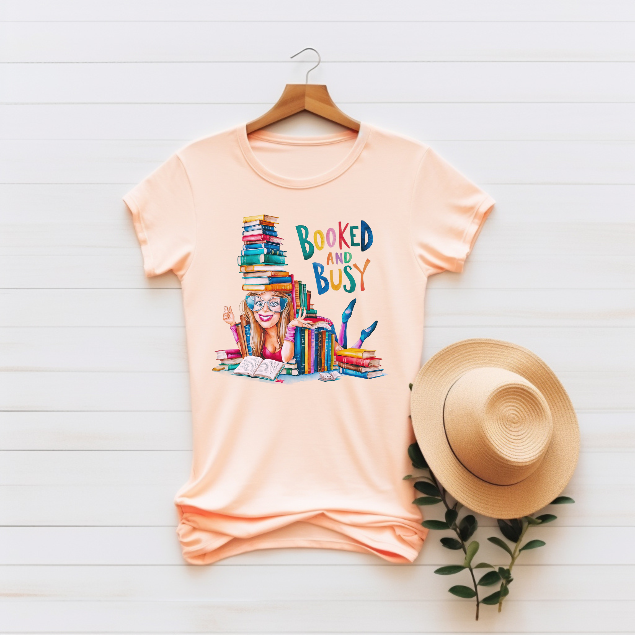 “Booked and Busy” Unisex Graphic Tee product thumbnail image