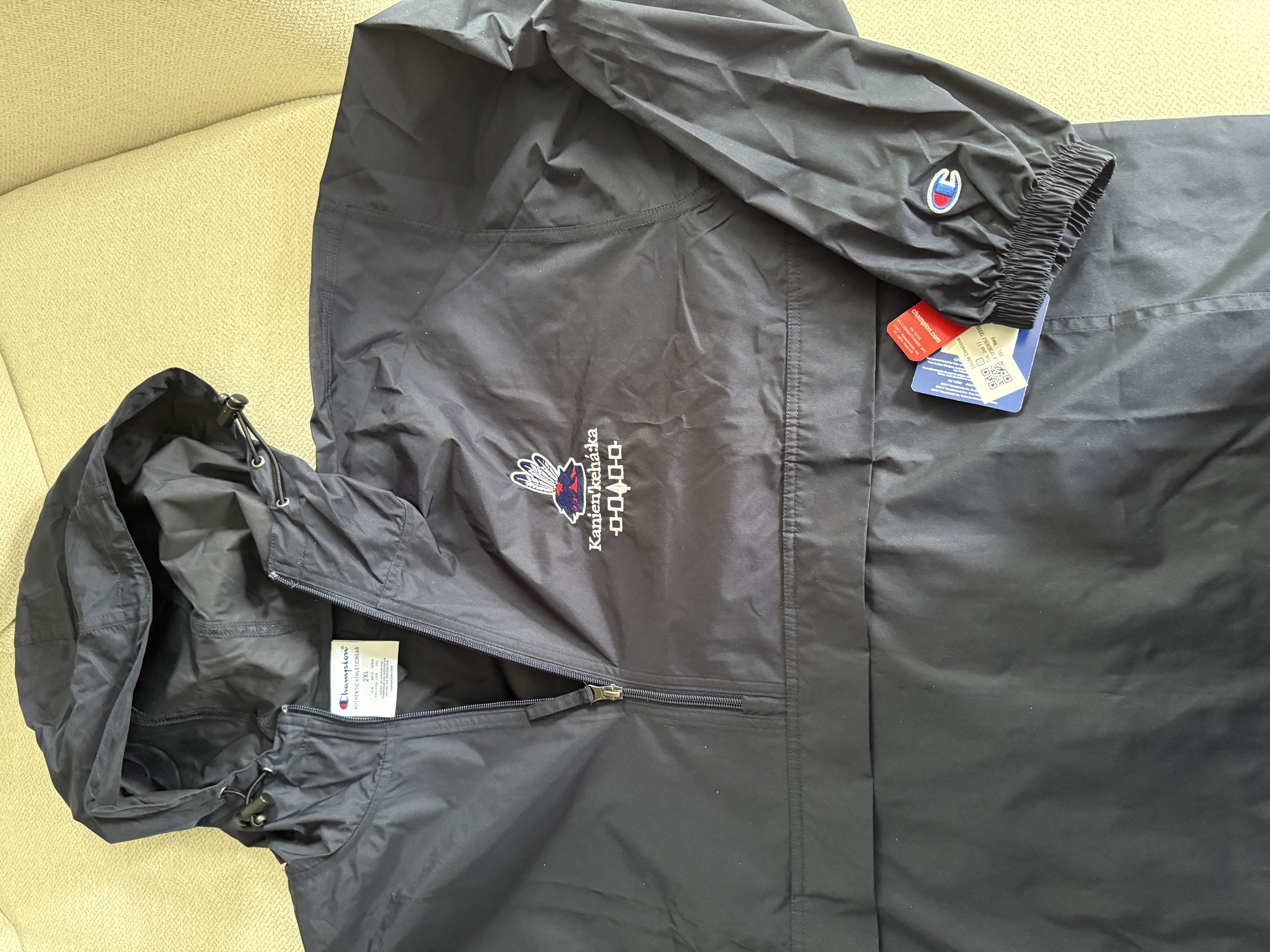 Mohawk Haudenosaunee Kanien'kehá:ka Packable Anorak Jacket - Stylish Raincoat for Outdoor Adventures, Indigenous Jacket, White Stitching product thumbnail image Mohawk Haudenosaunee Kanien'kehá:ka Packable Anorak Jacket - Stylish Raincoat for Outdoor Adventures, Indigenous Jacket, White Stitching product thumbnail image