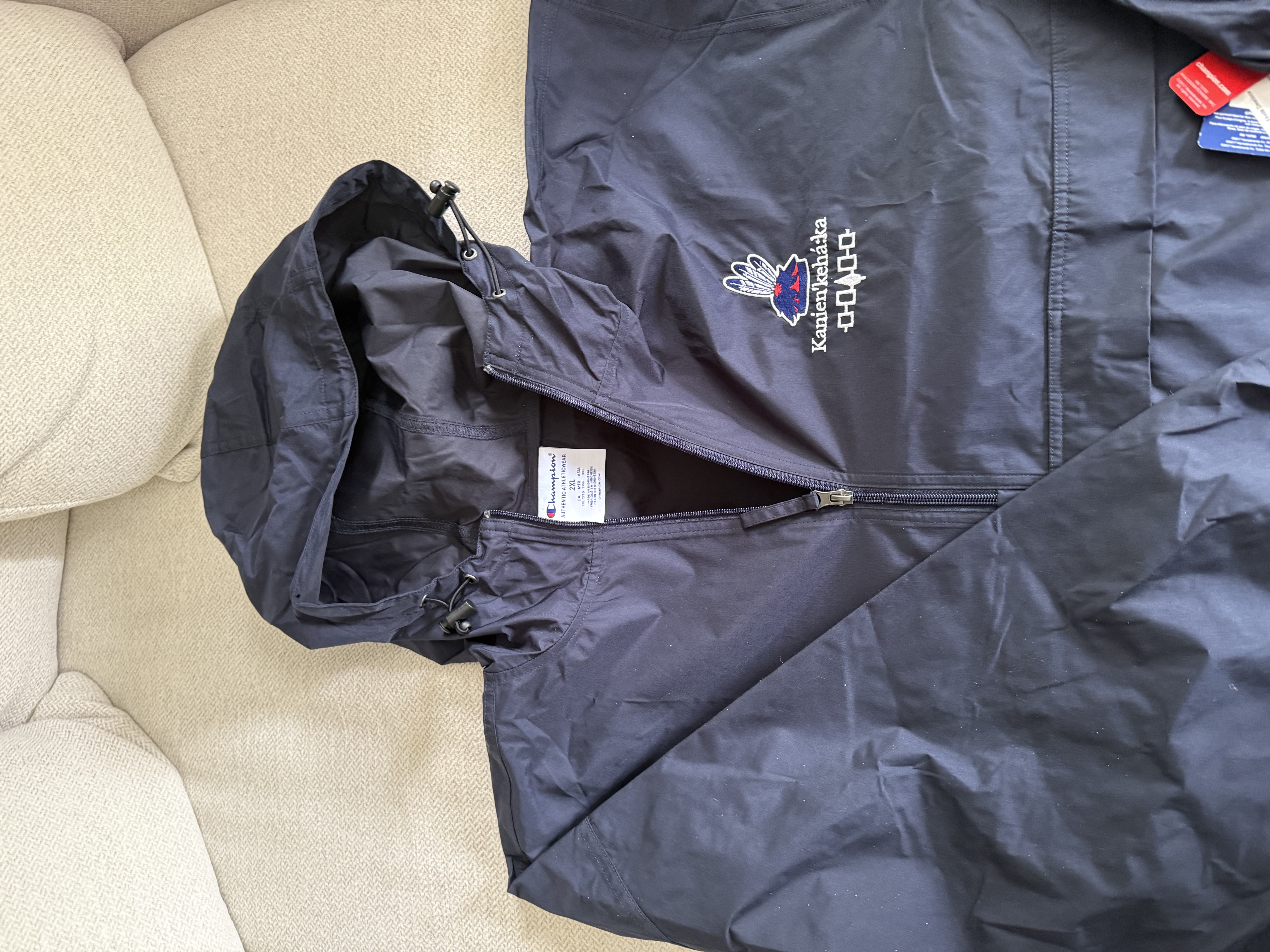 Mohawk Haudenosaunee Kanien'kehá:ka Packable Anorak Jacket - Stylish Raincoat for Outdoor Adventures, Indigenous Jacket, White Stitching product thumbnail image Mohawk Haudenosaunee Kanien'kehá:ka Packable Anorak Jacket - Stylish Raincoat for Outdoor Adventures, Indigenous Jacket, White Stitching product thumbnail image