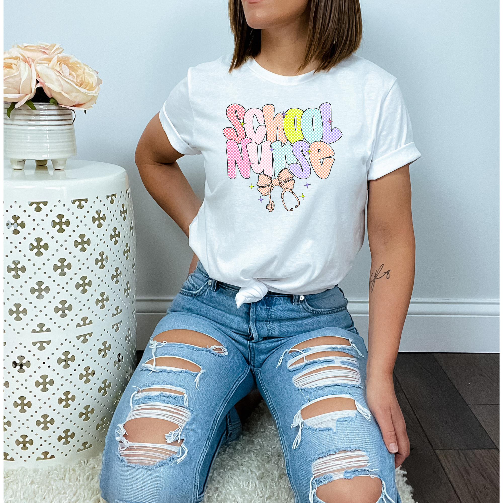 School Nurse T-Shirt | Colorful Checkered Nurse Tee | Cute Nurse Appreciation Shirt | Back to School Gift | Nurse Squad Shirt | Retro Nurse Tee product thumbnail image School Nurse T-Shirt | Colorful Checkered Nurse Tee | Cute Nurse Appreciation Shirt | Back to School Gift | Nurse Squad Shirt | Retro Nurse Tee product thumbnail image