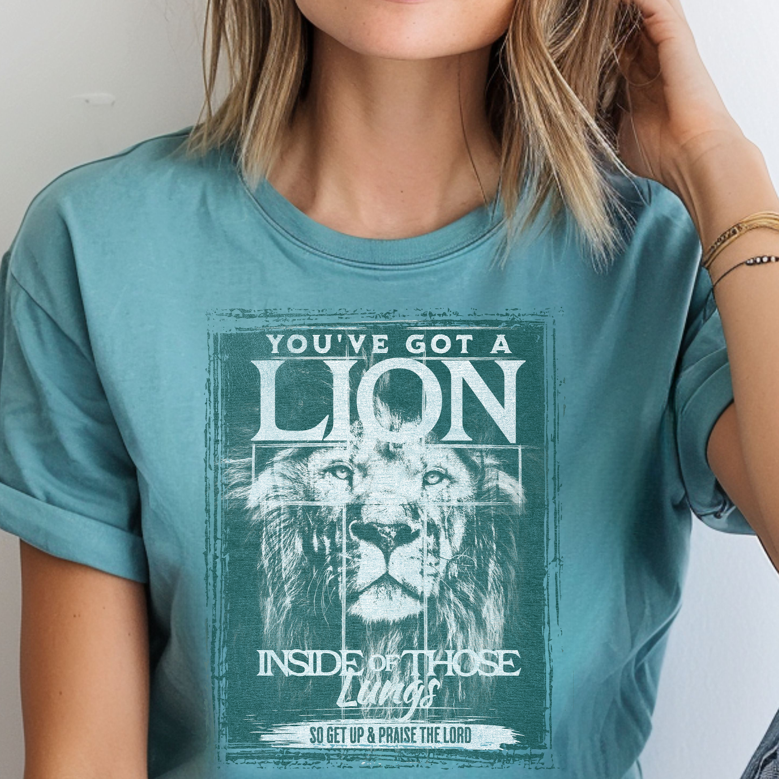 "You’ve Got a Lion Inside of Those Lungs" Christian T-Shirt - Faded Green Print product thumbnail image "You’ve Got a Lion Inside of Those Lungs" Christian T-Shirt - Faded Green Print product thumbnail image