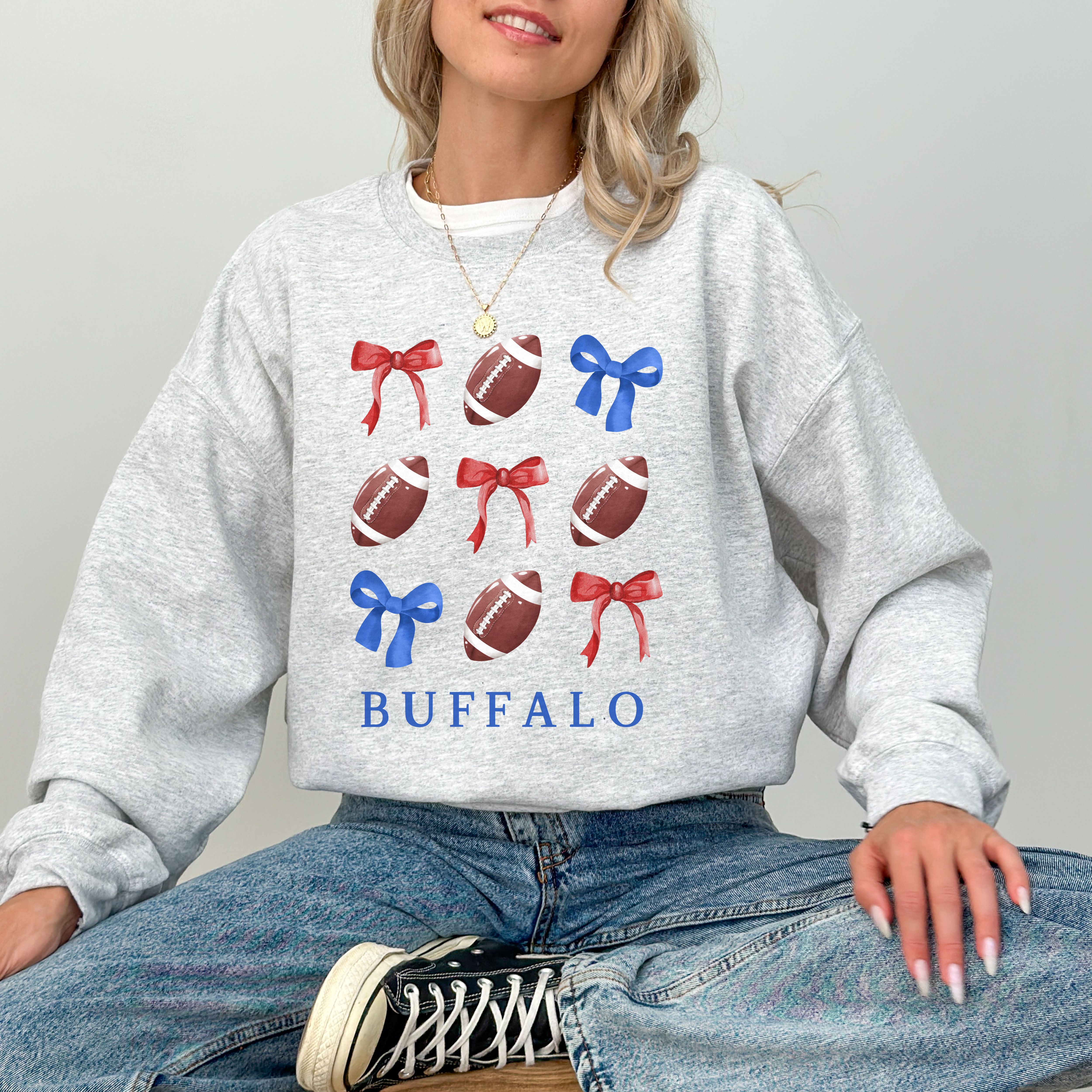 Buffalo Bows - Football & Bows Crewneck Sweatshirt Sportswear for Game Day, Gift for Sports Lovers, Buffalo Tailgate, Unisex Sweater product thumbnail image Buffalo Bows - Football & Bows Crewneck Sweatshirt Sportswear for Game Day, Gift for Sports Lovers, Buffalo Tailgate, Unisex Sweater product thumbnail image