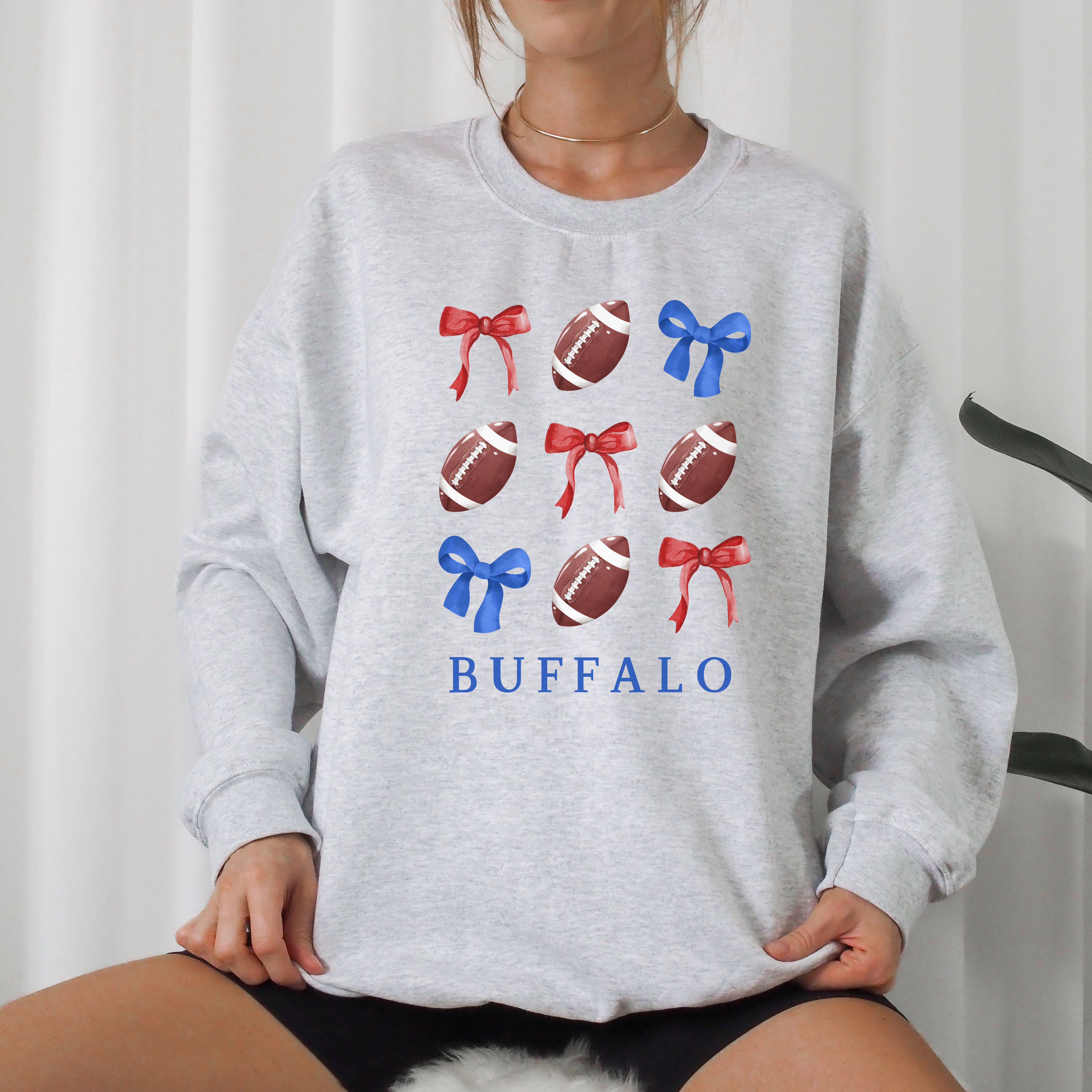 Buffalo Bows - Football & Bows Crewneck Sweatshirt Sportswear for Game Day, Gift for Sports Lovers, Buffalo Tailgate, Unisex Sweater product thumbnail image Buffalo Bows - Football & Bows Crewneck Sweatshirt Sportswear for Game Day, Gift for Sports Lovers, Buffalo Tailgate, Unisex Sweater product thumbnail image