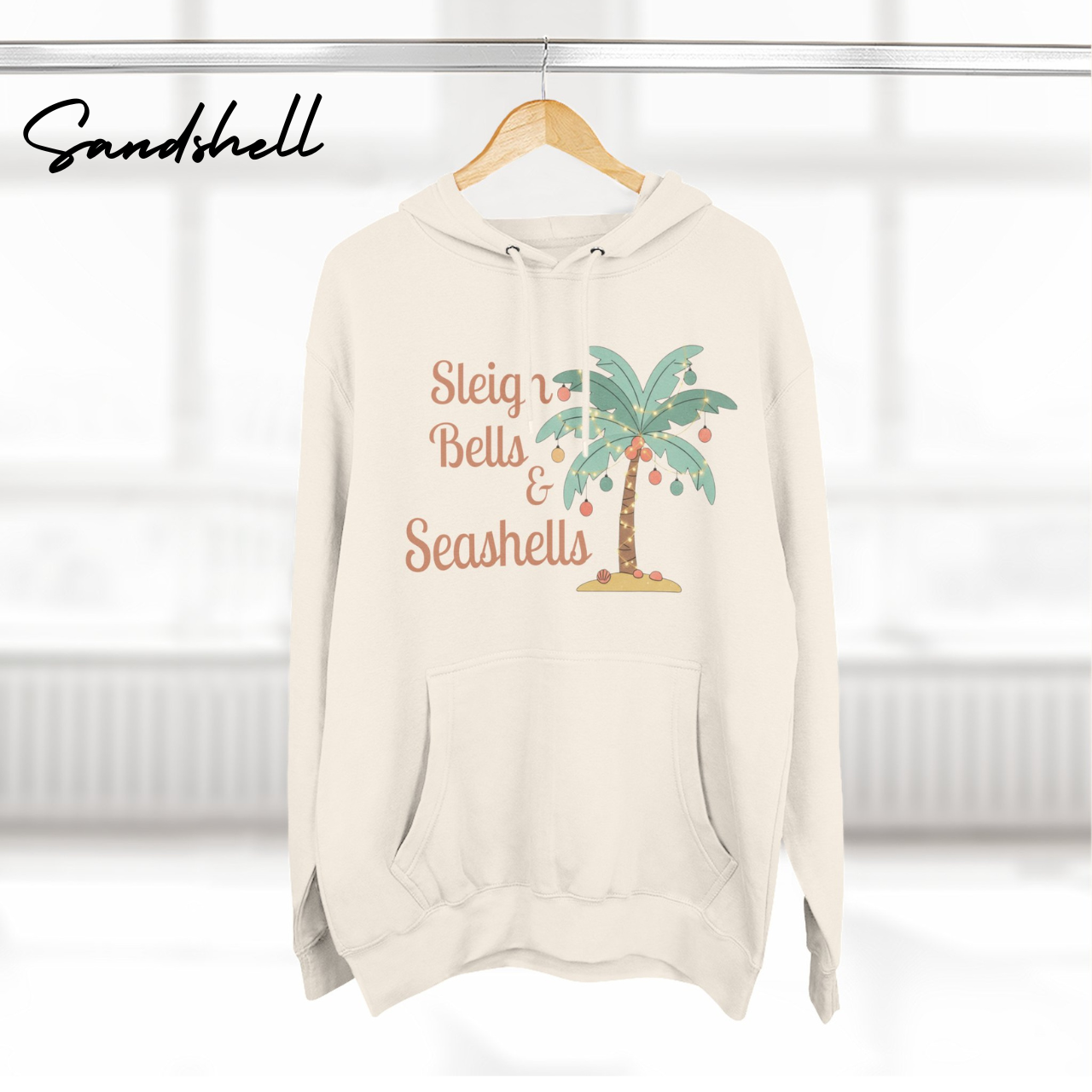 Sleigh Bells & Seashells Coastal Christmas Hoodie product thumbnail image Sleigh Bells & Seashells Coastal Christmas Hoodie product thumbnail image