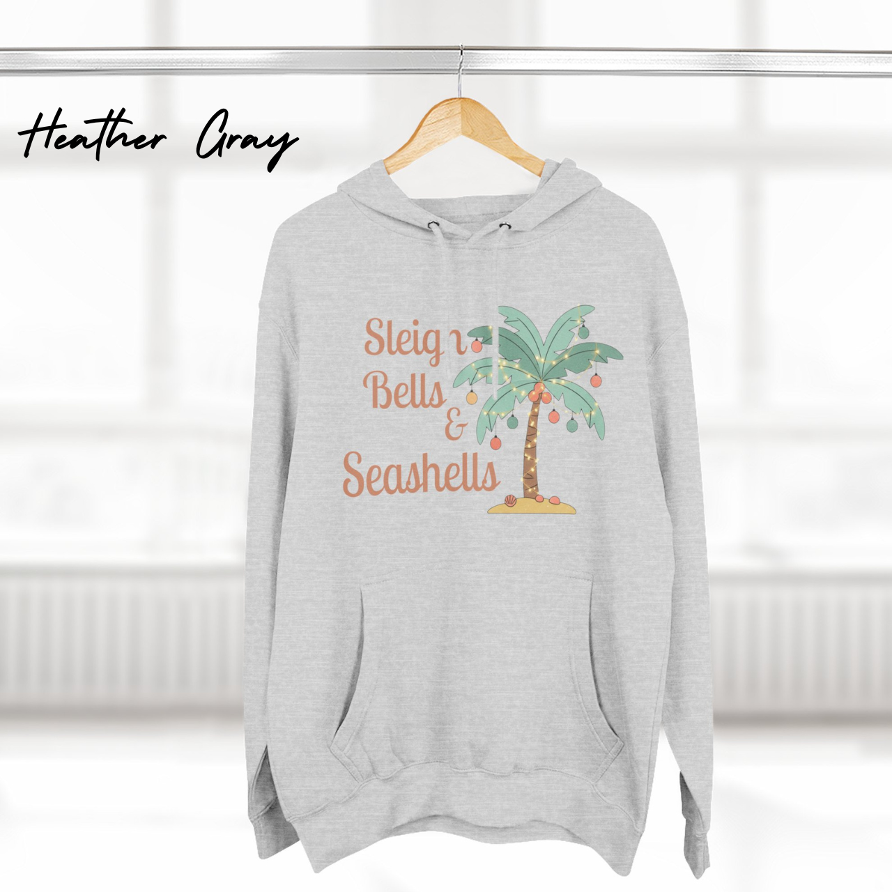 Sleigh Bells & Seashells Coastal Christmas Hoodie product thumbnail image Sleigh Bells & Seashells Coastal Christmas Hoodie product thumbnail image