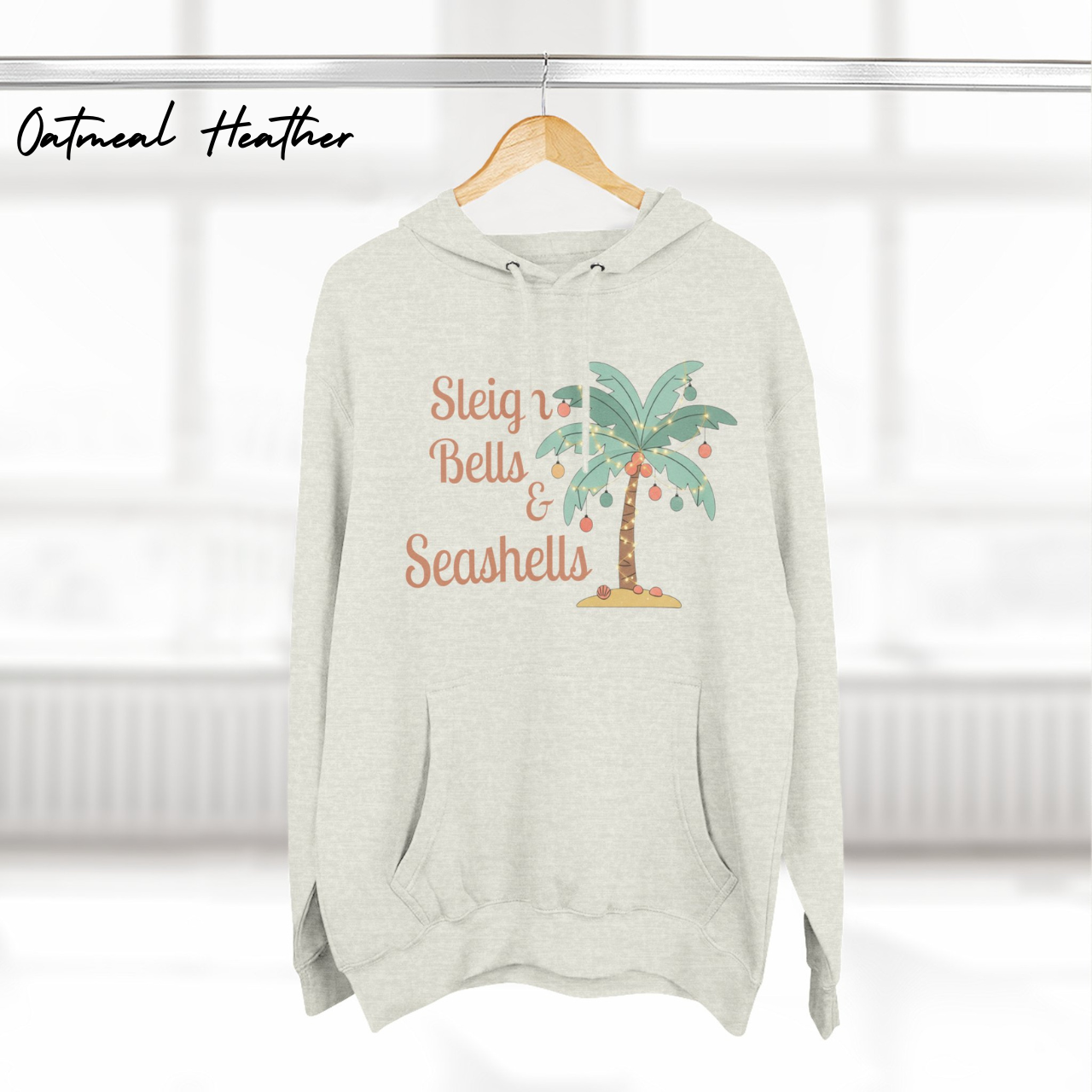 Sleigh Bells & Seashells Coastal Christmas Hoodie product thumbnail image Sleigh Bells & Seashells Coastal Christmas Hoodie product thumbnail image