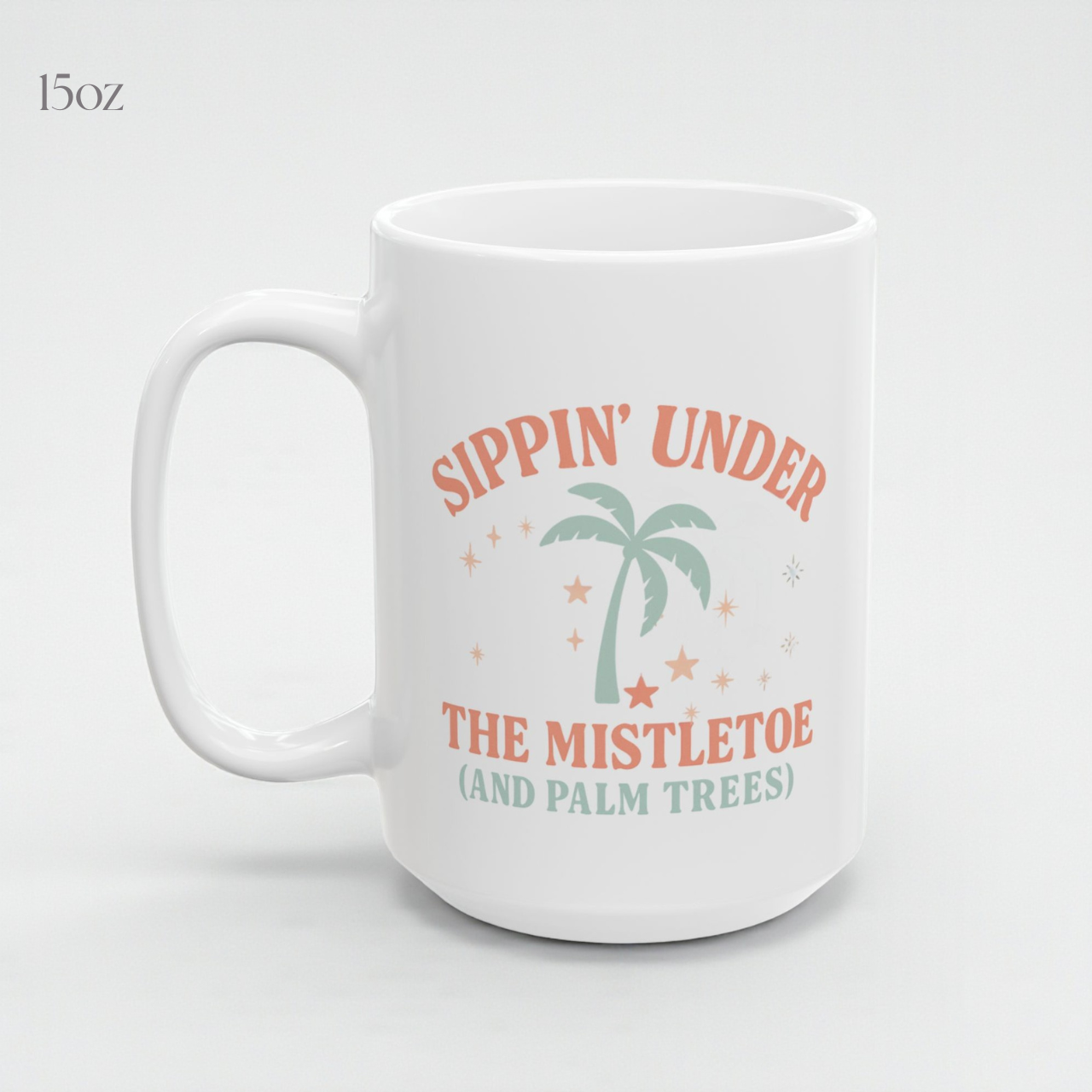 Sippin’ Under the Mistletoe (and Palm Trees) Dual-Sided Christmas Mug | Tropical Holiday Coffee Cup | Coastal Christmas Gift | Ceramic 11oz &amp; 15oz Mug | Dishwasher &amp; Microwave Safe | Beachy Winter Vibes Drinkware product thumbnail image