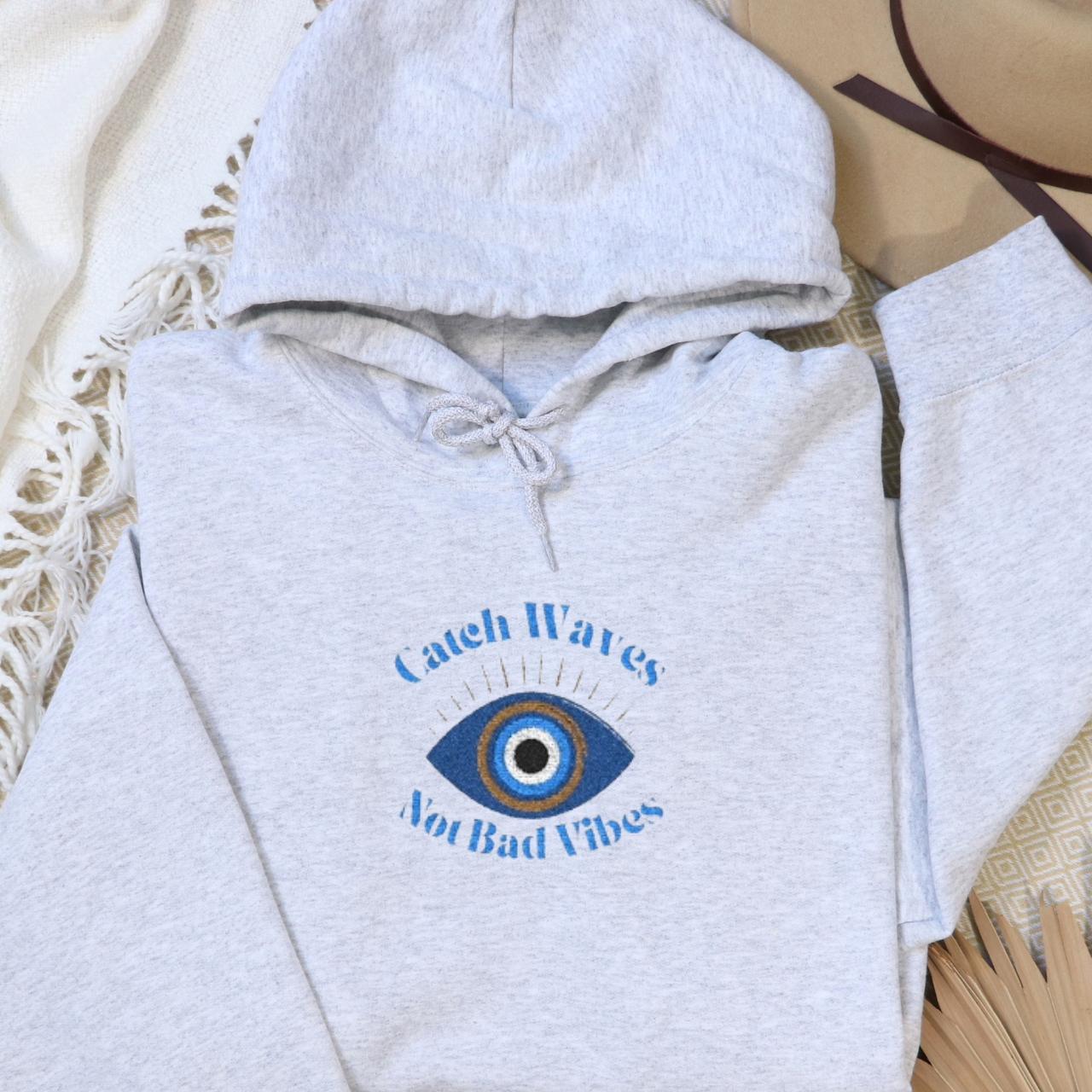 Catch Waves Not Bad Vibes Hoodie | Embroidered Evil Eye Hoodie | Coastal Protection Sweatshirt | Beachy Summer Hoodie | Good Vibes Gift product thumbnail image Catch Waves Not Bad Vibes Hoodie | Embroidered Evil Eye Hoodie | Coastal Protection Sweatshirt | Beachy Summer Hoodie | Good Vibes Gift product thumbnail image