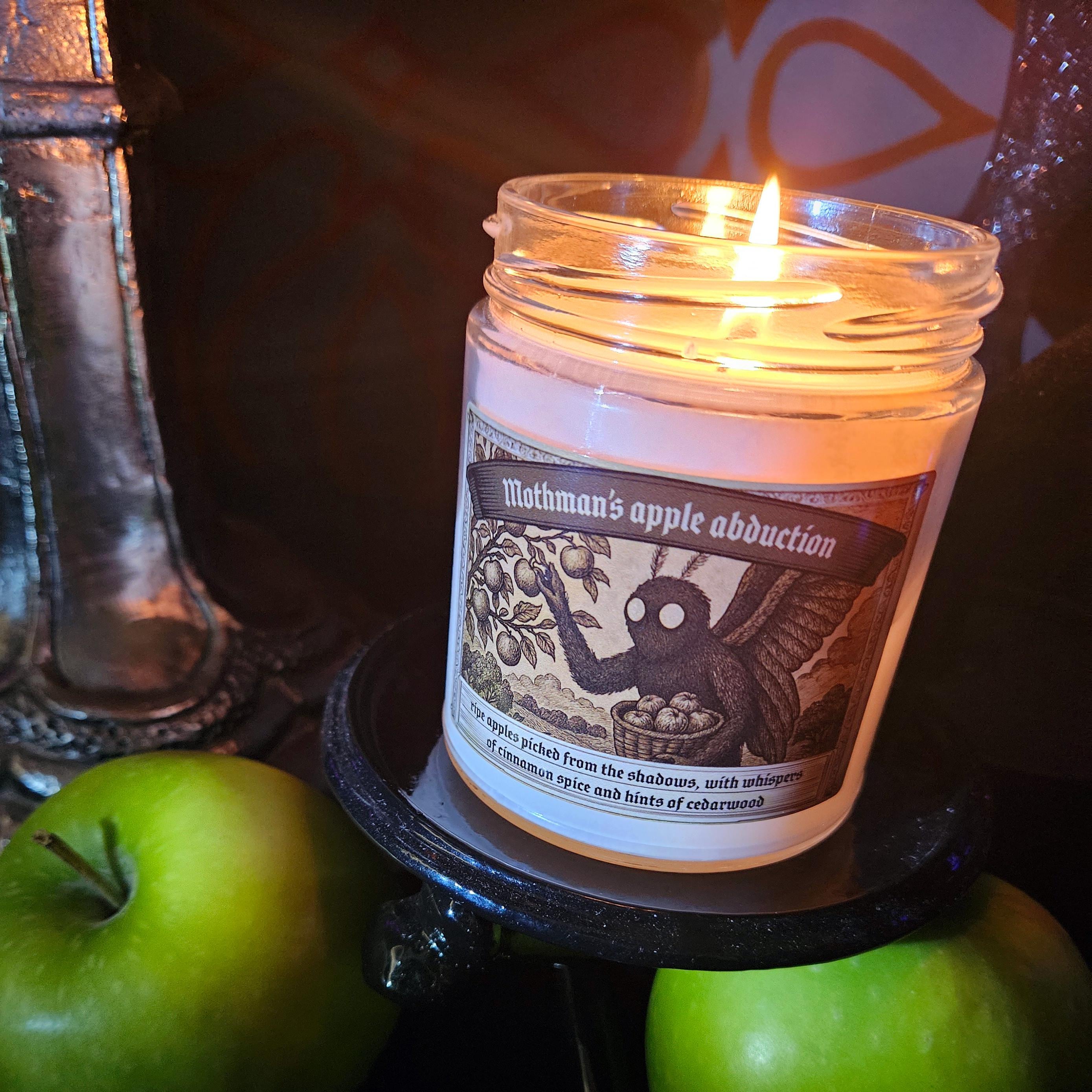 Mothman's Apple Abduction scented candle - Apple Spice Fragrance, Paranormal Home Decor, Gift for Cryptid Enthusiasts, 9oz Jar Candle product thumbnail image