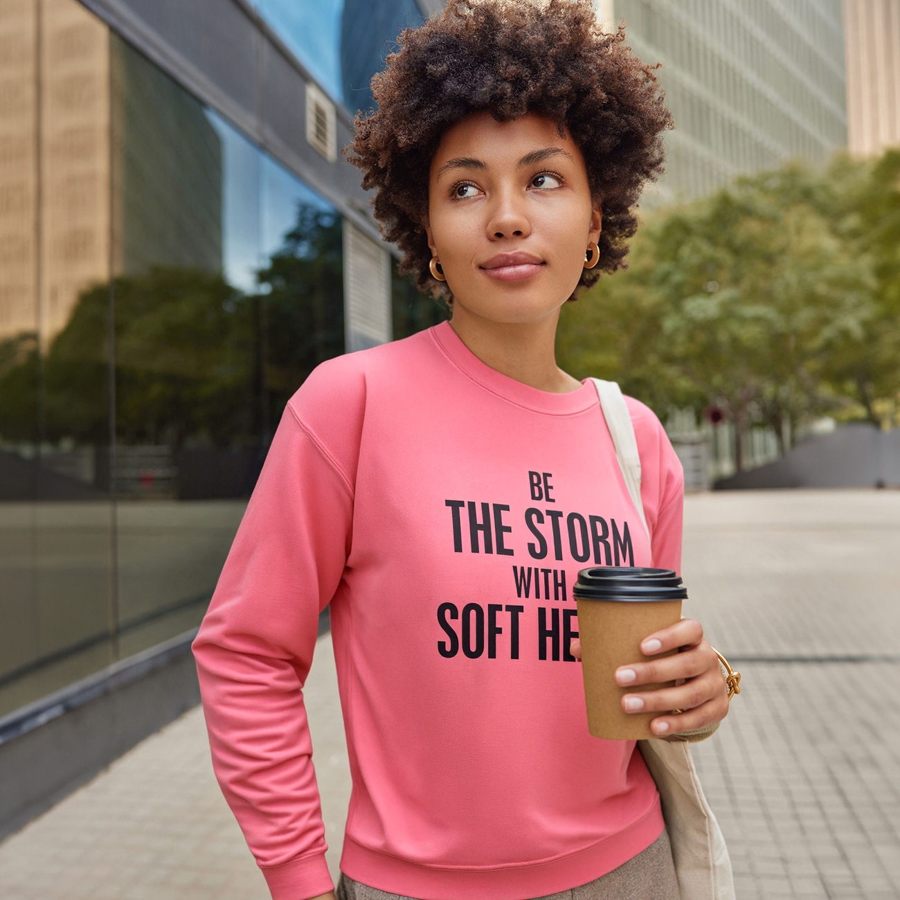 Crewneck Sweatshirt — "Be the Storm with a Soft Heart" Motivational Graphic product thumbnail image