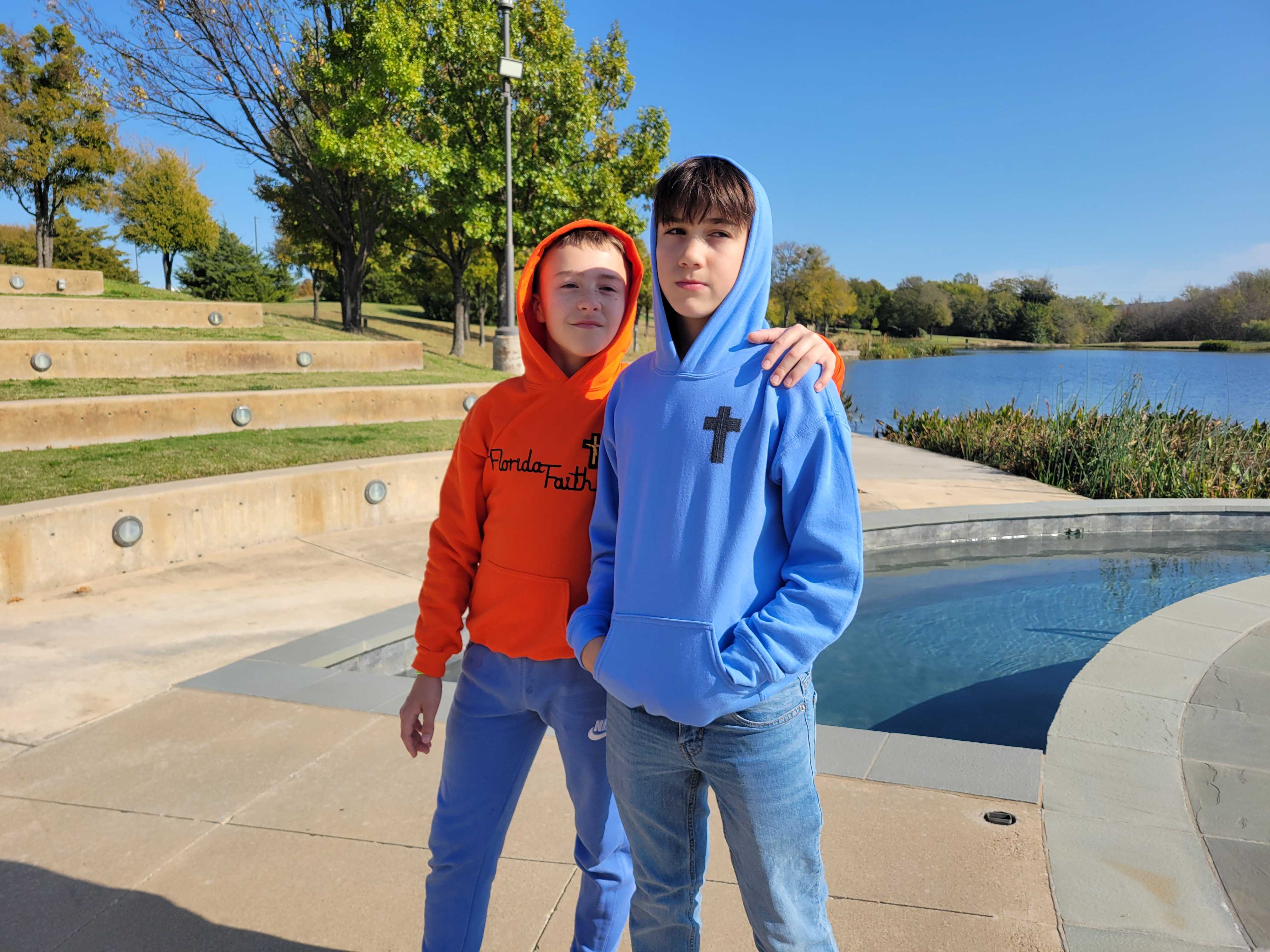 Philippians 4:13 "I Can Do All Things Through Christ" Tire Tracks Cross Youth Hoodie product thumbnail image Philippians 4:13 "I Can Do All Things Through Christ" Tire Tracks Cross Youth Hoodie product thumbnail image