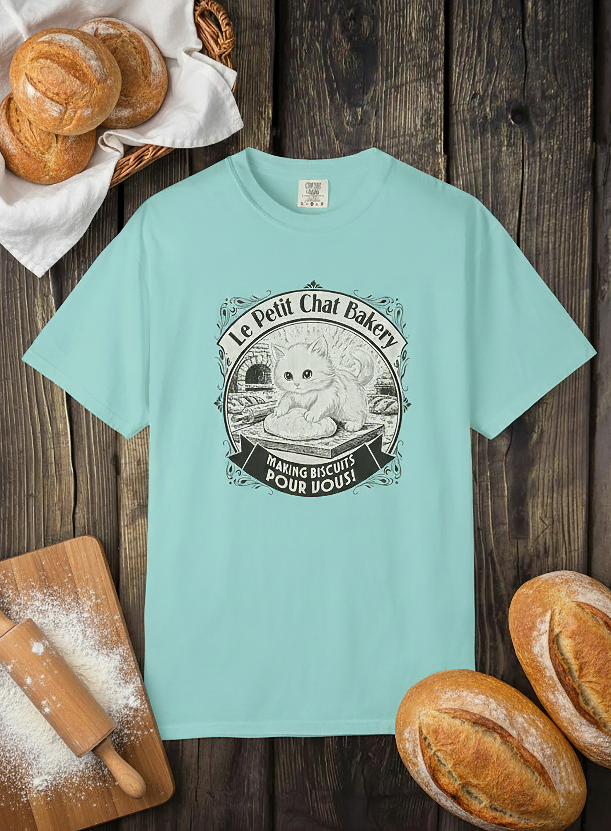 Le Petit Chat Bakery T‑Shirt — Cute Cat Baking Graphic Tee product thumbnail image