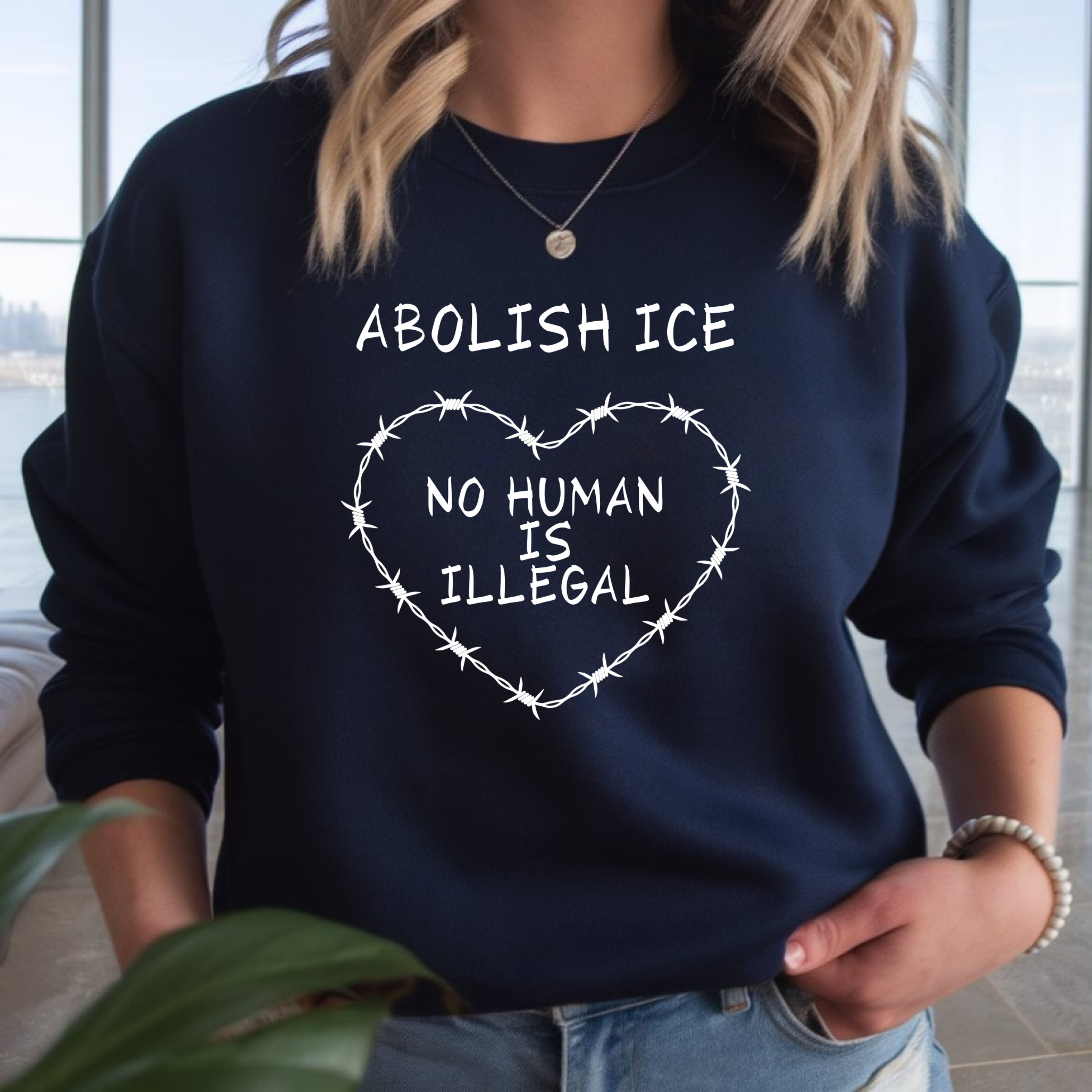Abolish ICE "No Human Is Illegal" Crewneck Sweatshirt product thumbnail image Abolish ICE "No Human Is Illegal" Crewneck Sweatshirt product thumbnail image