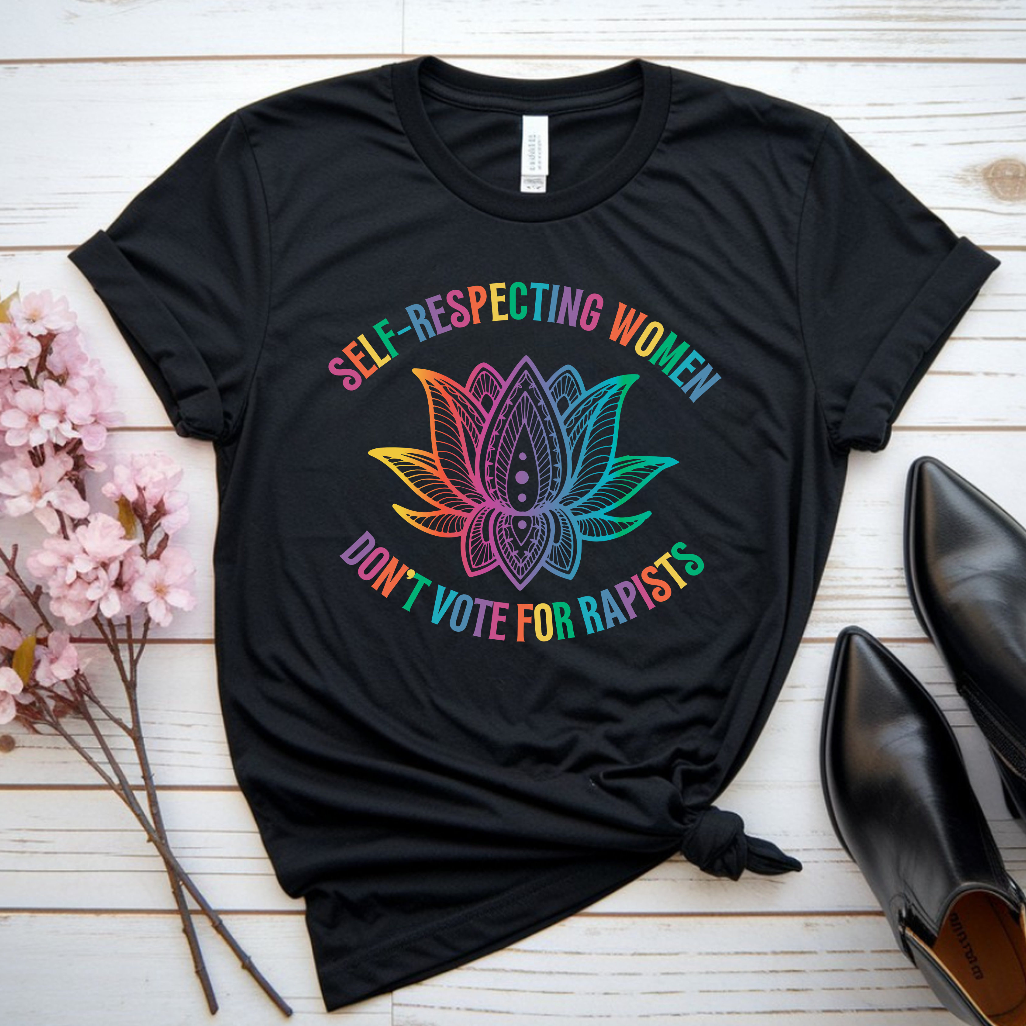 "Self-Respecting Women Don’t Vote for Rapists" Rainbow Lotus Tee