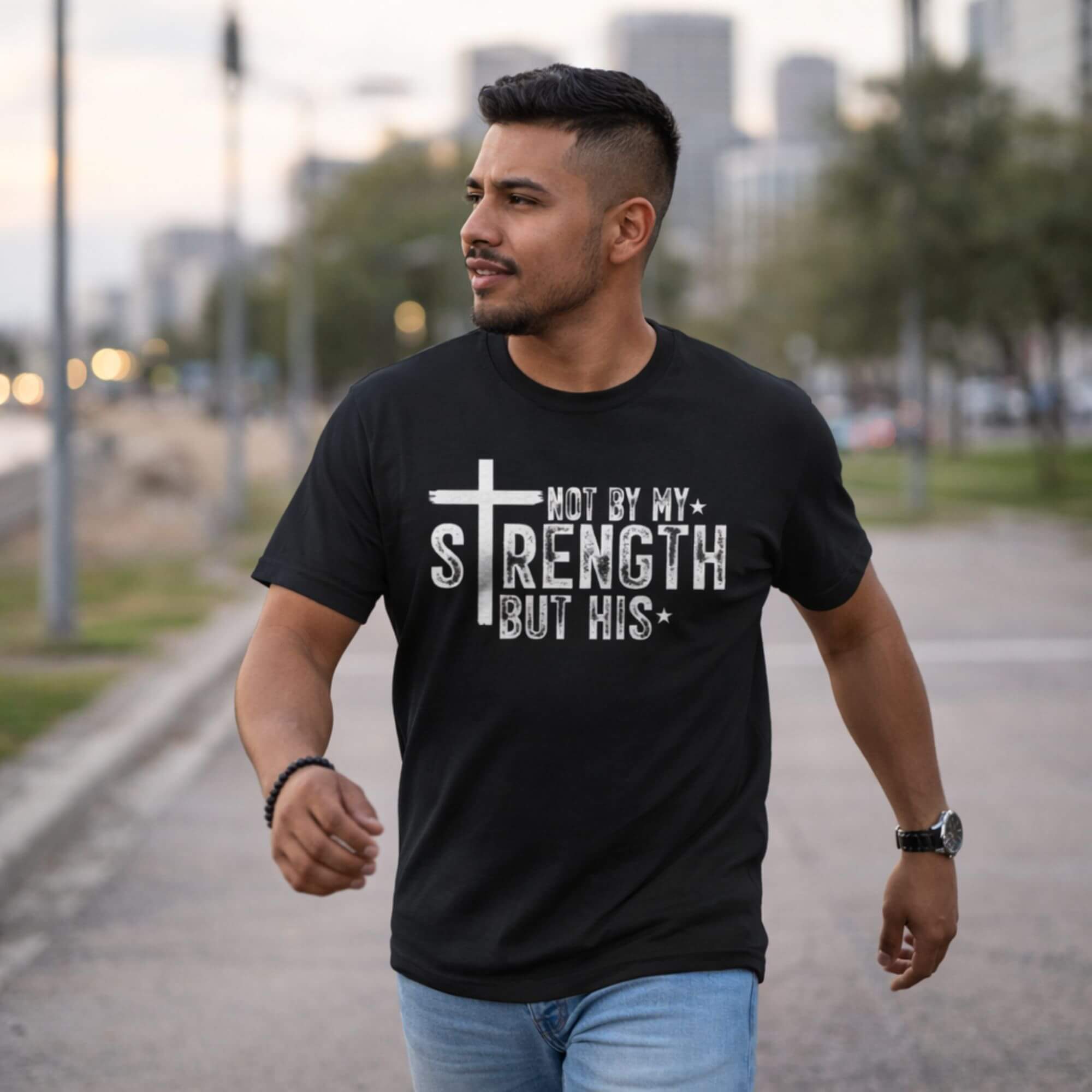 Not By My Strength But His Cross Graphic Tee product thumbnail image Not By My Strength But His Cross Graphic Tee product thumbnail image