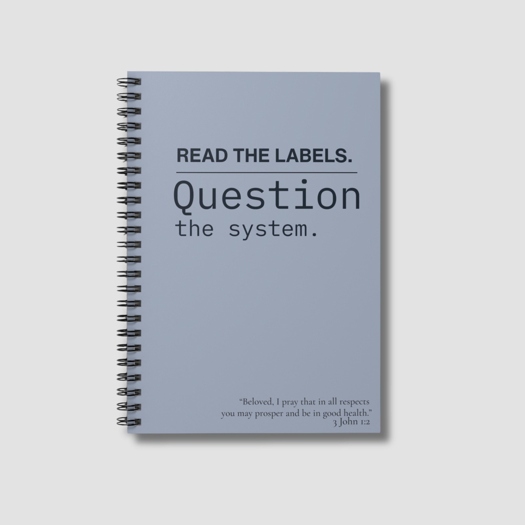 Notebook — "Read the Labels. Question the System." Spiral Ruled Journal - Slate Blue