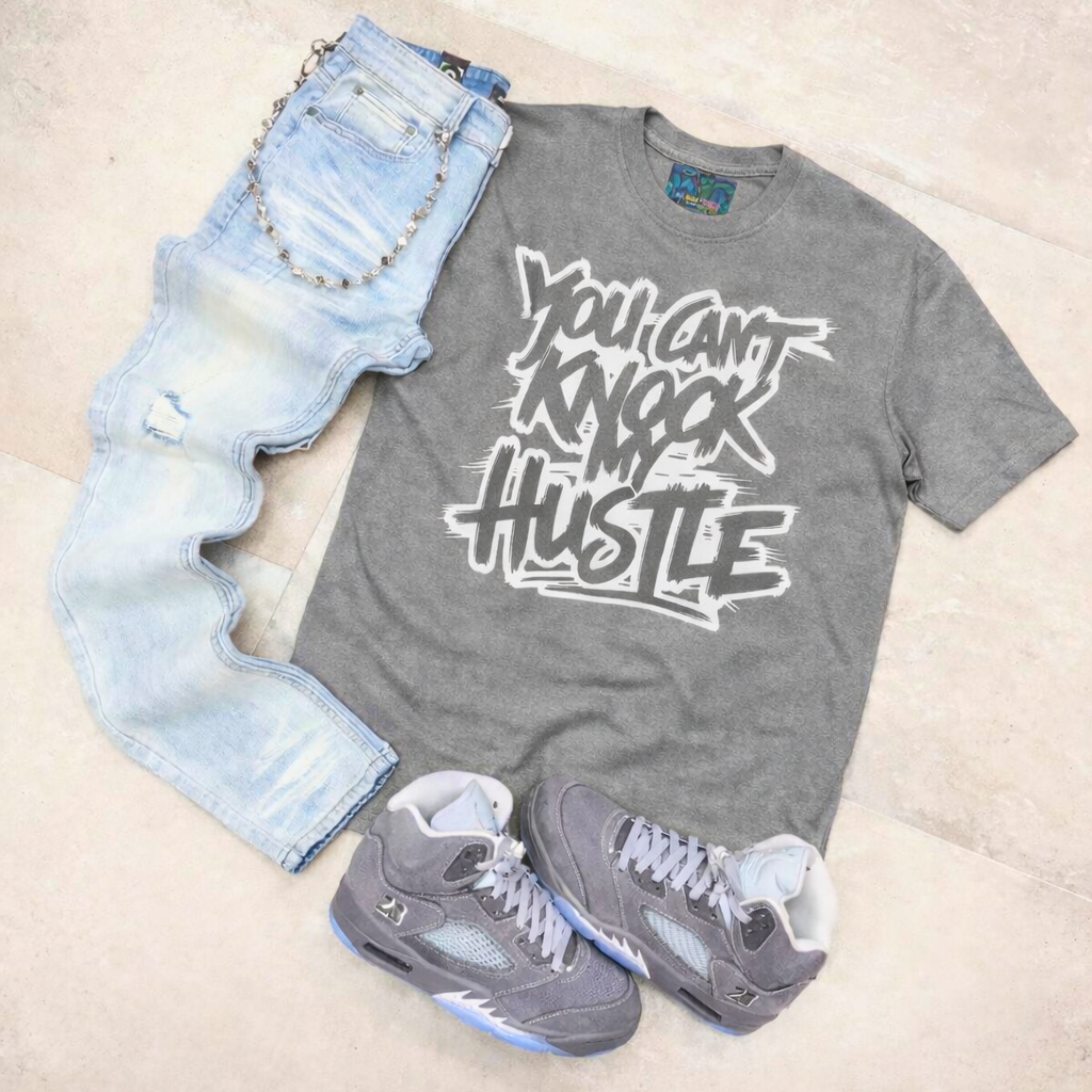 Unisex "YOU CAN'T KNOCK MY HUSTLE" Grey/White Staple Tee.