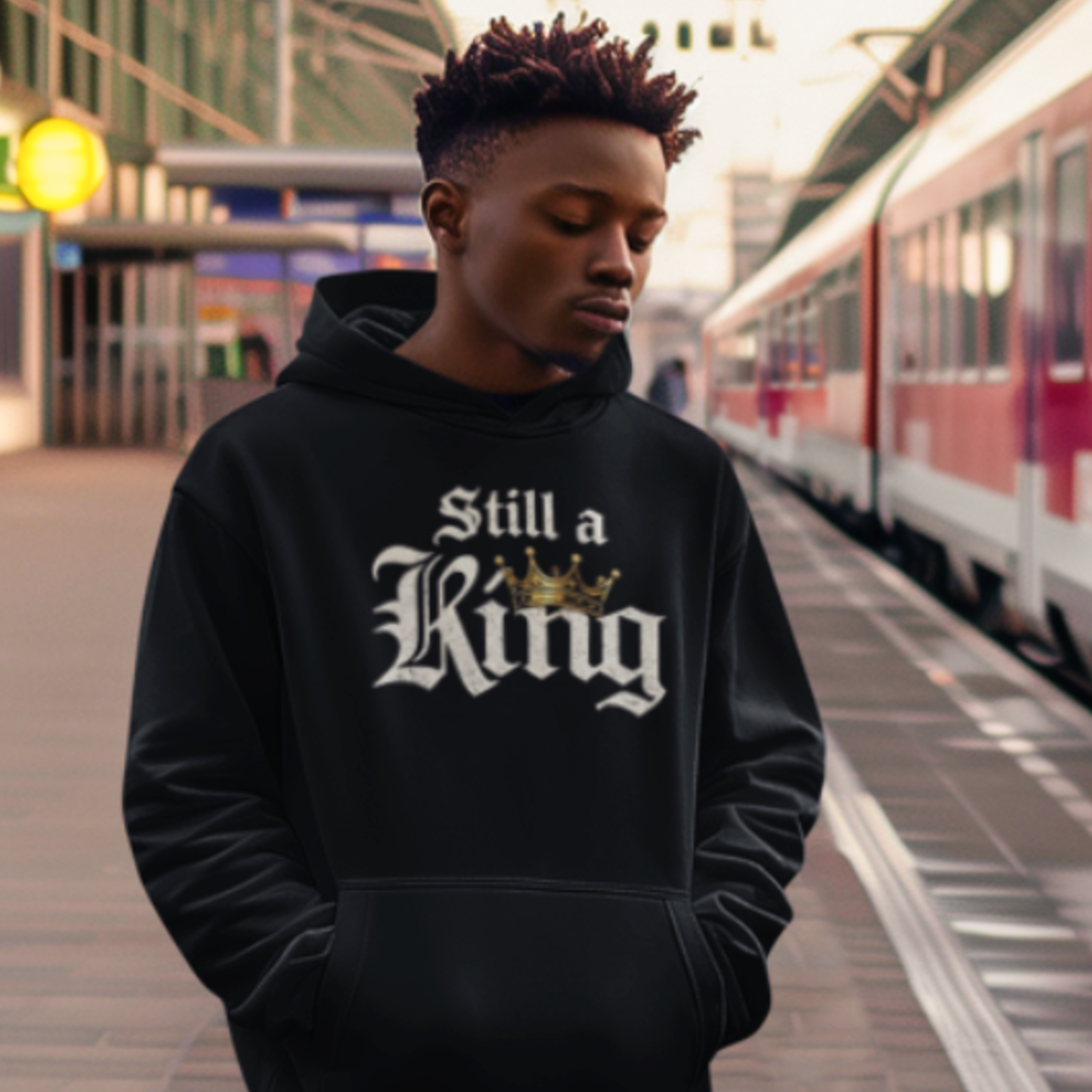 Still a King Hoodie — "Survived What Tried to Break Me" Motivational Crown Sweatshirt product thumbnail image