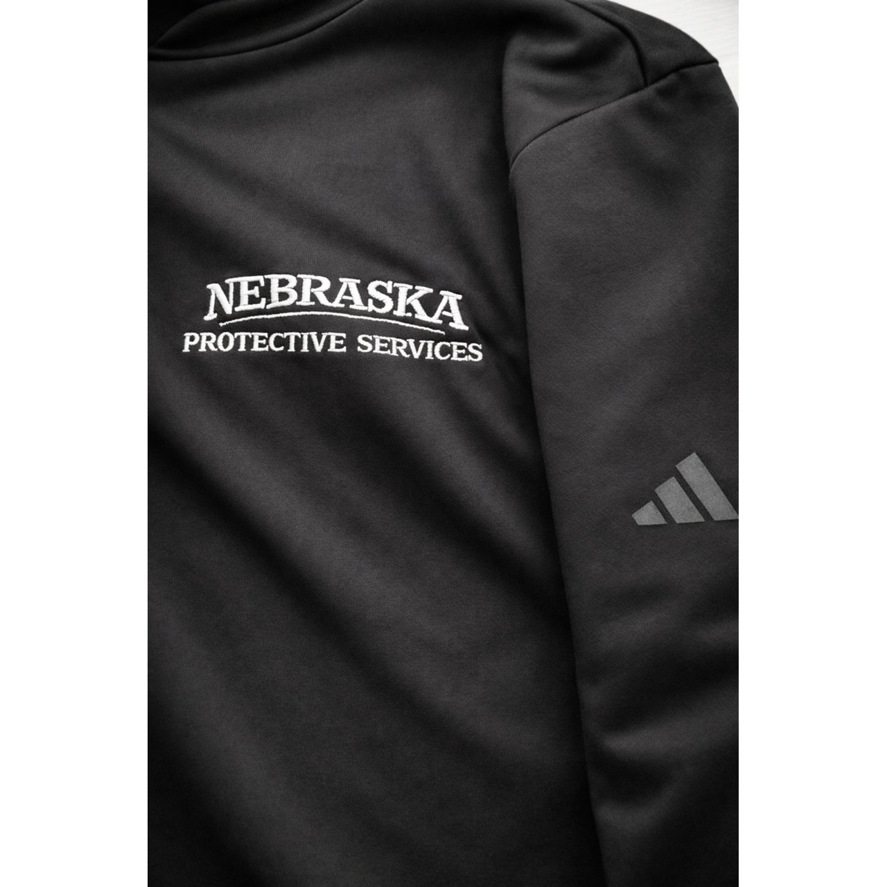Nebraska Protective Services Adidas Quarter-Zip Pullover Dark Colors S-4XL