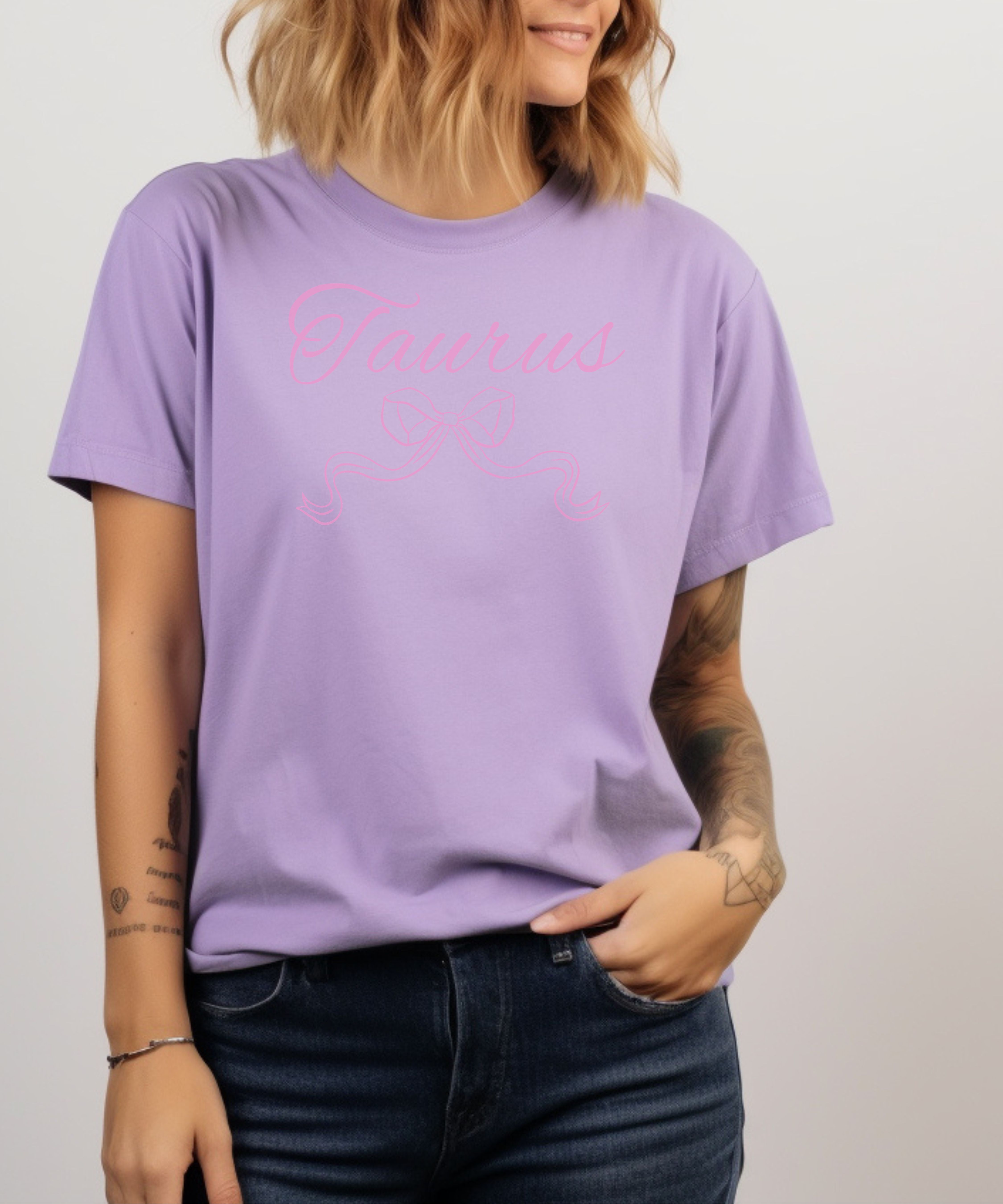 Taurus Zodiac T-Shirt Pink Script Astrological Tee product thumbnail image Taurus Zodiac T-Shirt Pink Script Astrological Tee product thumbnail image