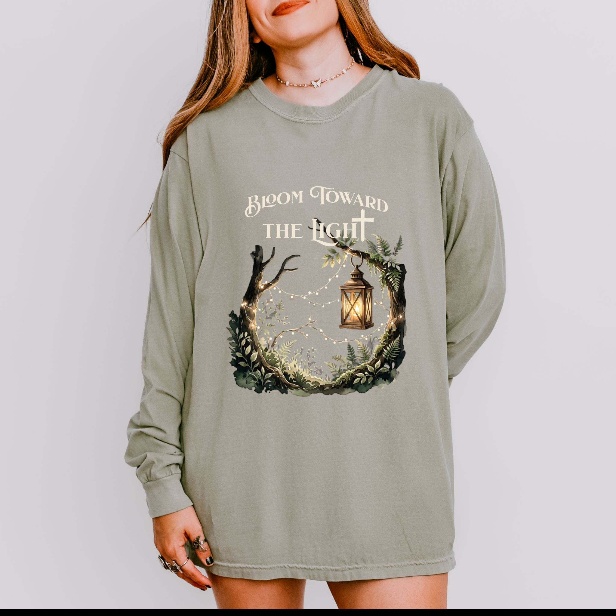 Bloom Toward The Light | Nature + Lantern Long Sleeve Shirt – Christian Graphic Shirt (Comfort Colors 6014) product thumbnail image Bloom Toward The Light | Nature + Lantern Long Sleeve Shirt – Christian Graphic Shirt (Comfort Colors 6014) product thumbnail image